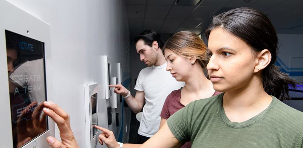 A group of friends picking a game at Activate