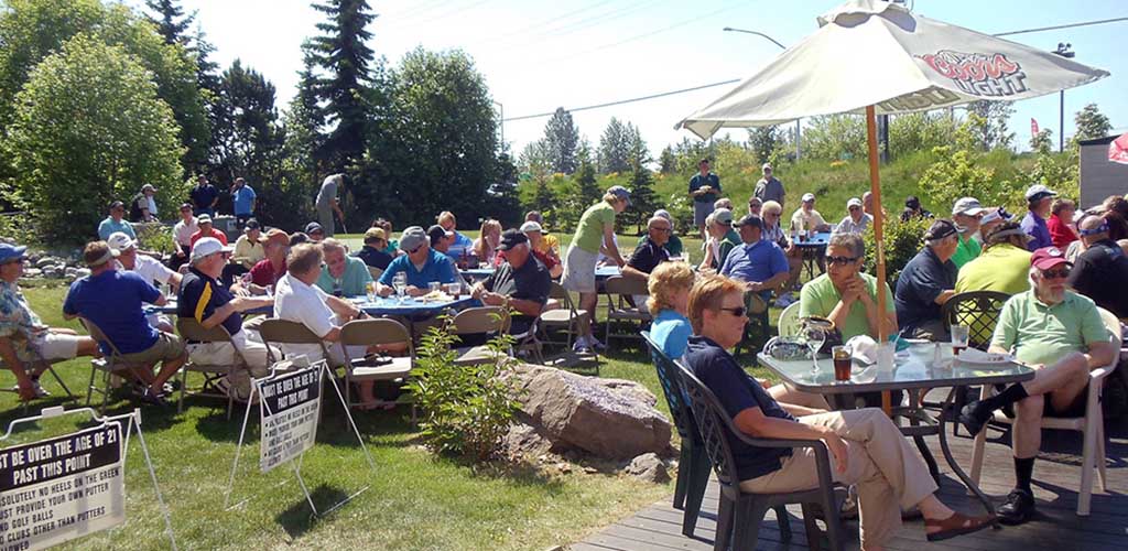 Patrons in the outdoor beer garden of Alaska Bradley House