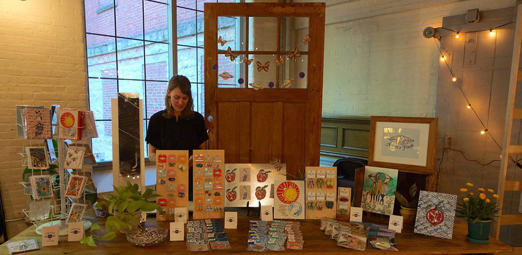 Beautiful woman selling crafts at Explore Frontier