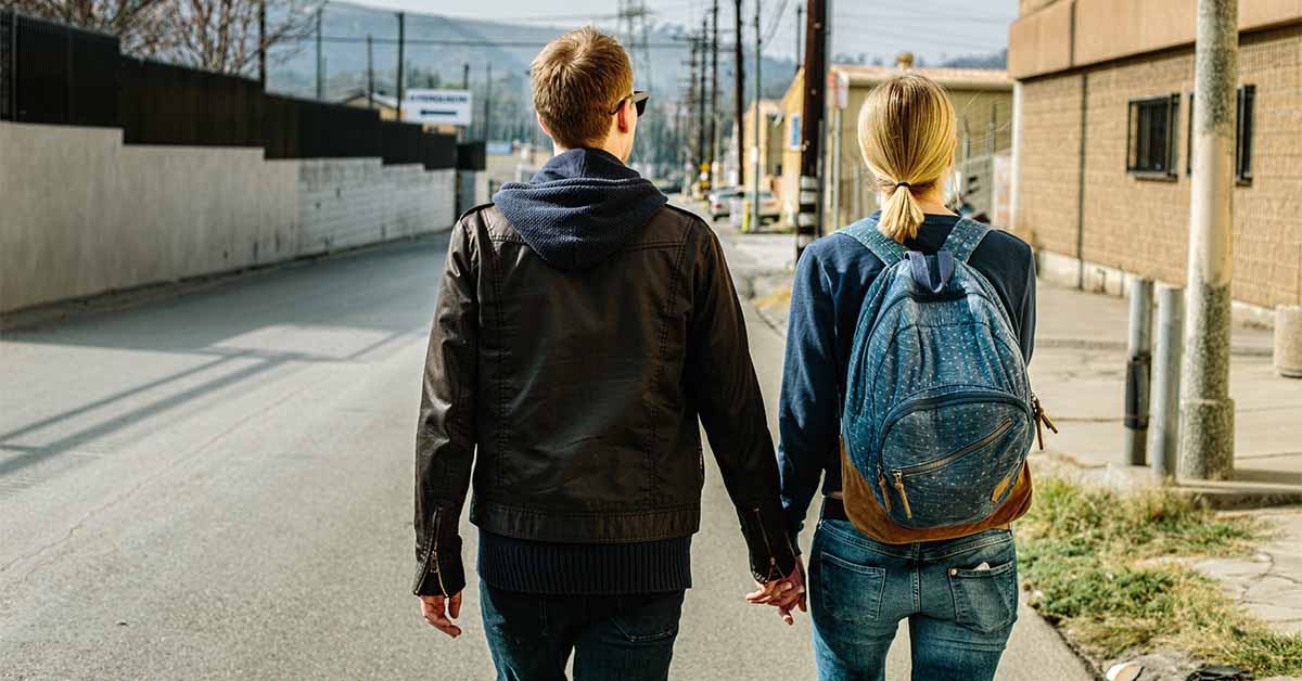 Girl and a guy talking on the street