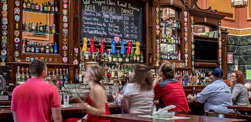 Friends chatting at the bar in RiRa