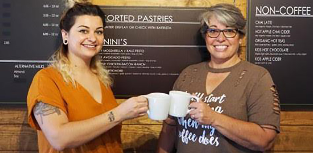 Two lovely ladies with coffee