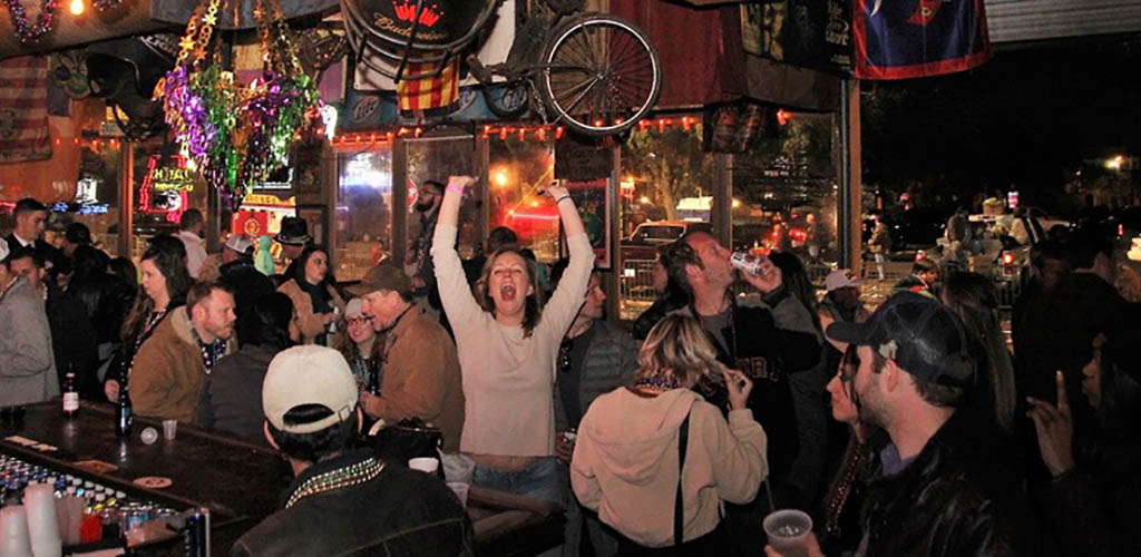 People at a lively party at The Garage