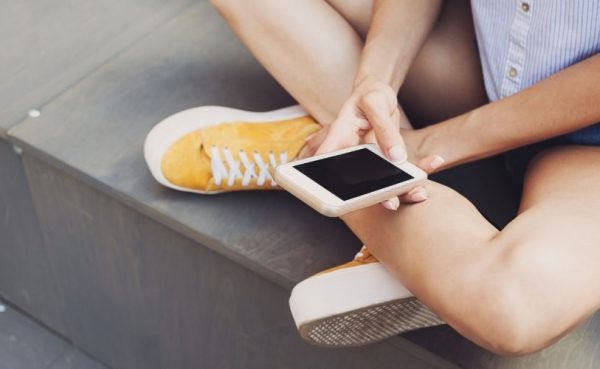 A girl texting lots of emojis can tell if she likes you over text