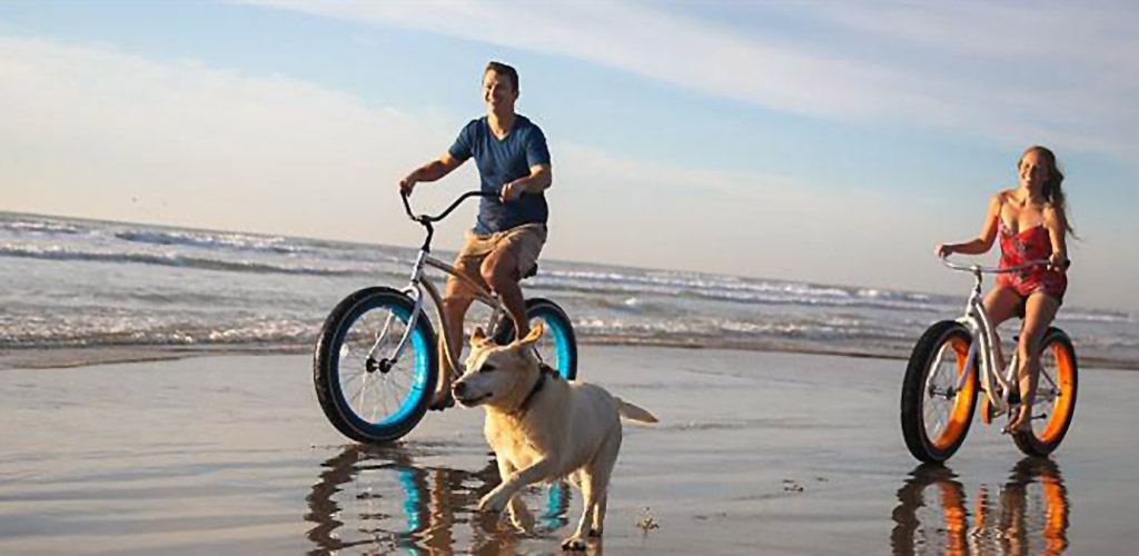 Biking along the beach at Padre Island Beach