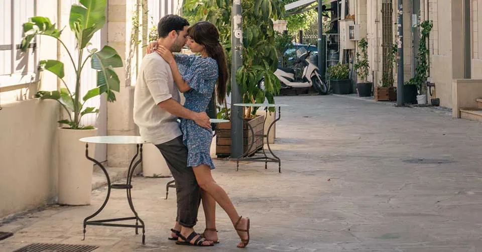 A couple kissing before hooking up