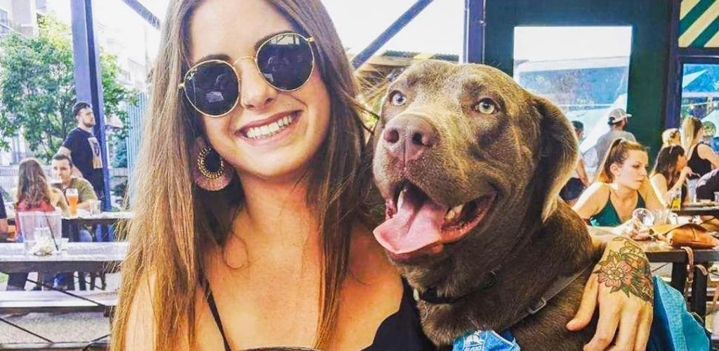 A Nashville cougar enjoying a day out with her dog at Von Elrod's Beer Hall